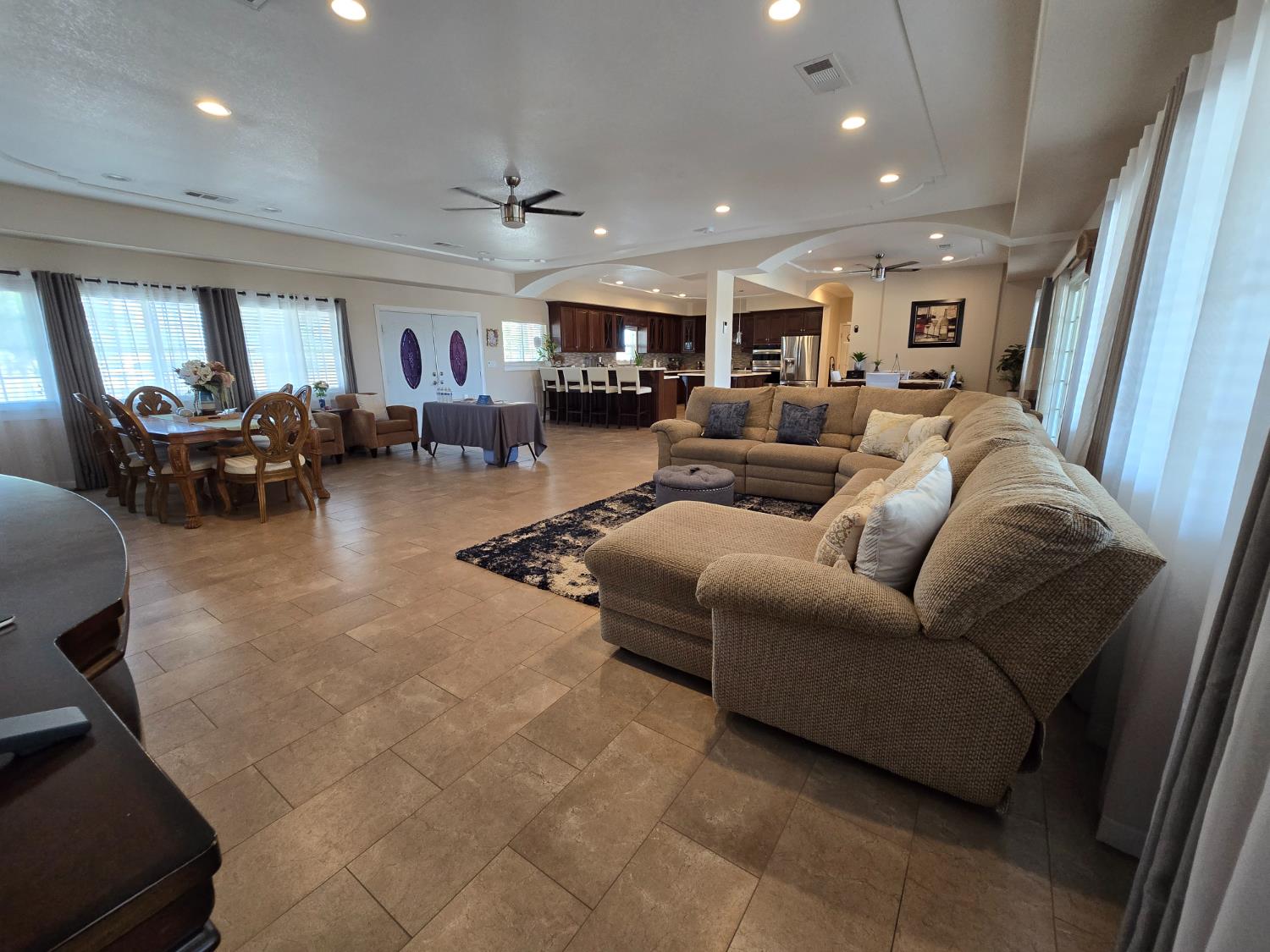 5995 West Brooks Road Merced, CA 95341 - Photo 8 of 23 a living room with furniture and a flat screen tv