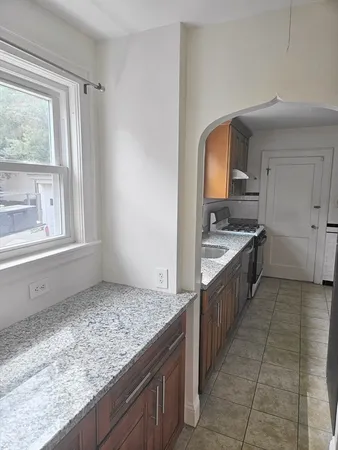 a kitchen with a stove and a sink