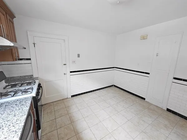 a view of a kitchen with a sink cabinets and a window