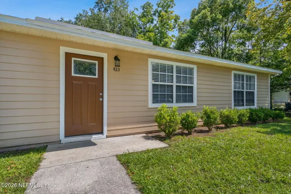 a front view of a house with a yard