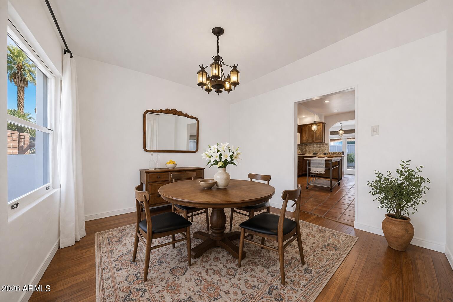 1555 East Cheery Lynn Road Phoenix, AZ 85014 - Photo 12 of 37 a view of a dining room with furniture window and wooden floor