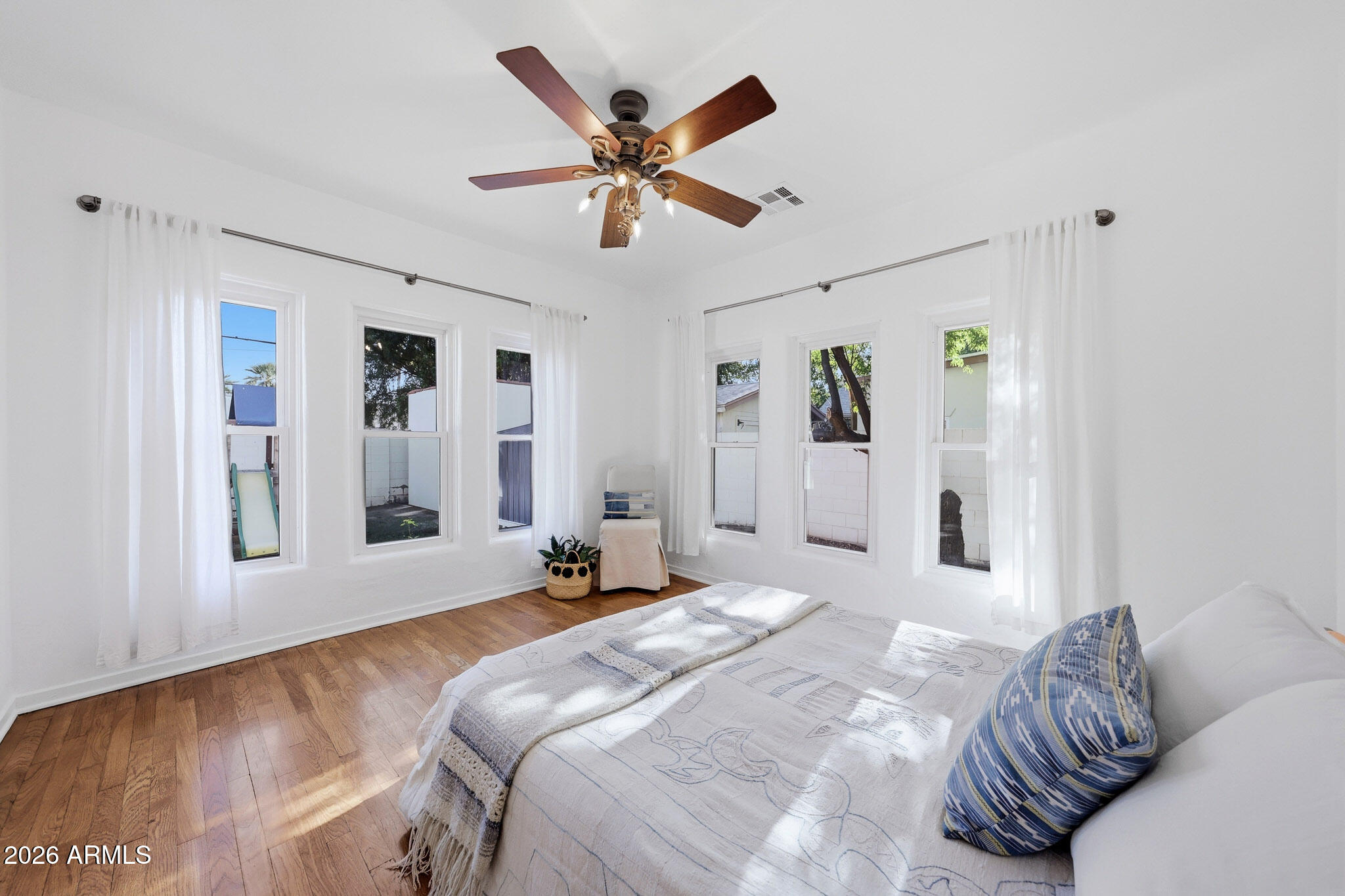 1555 East Cheery Lynn Road Phoenix, AZ 85014 - Photo 13 of 37 a bedroom with a large bed and a window