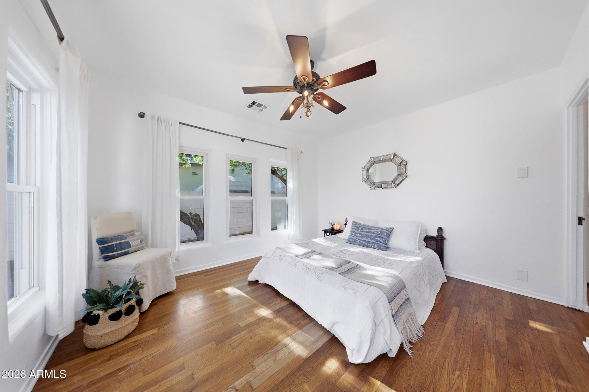 1555 East Cheery Lynn Road Phoenix, AZ 85014 - Photo 14 of 37 a bedroom with bed and wooden floor