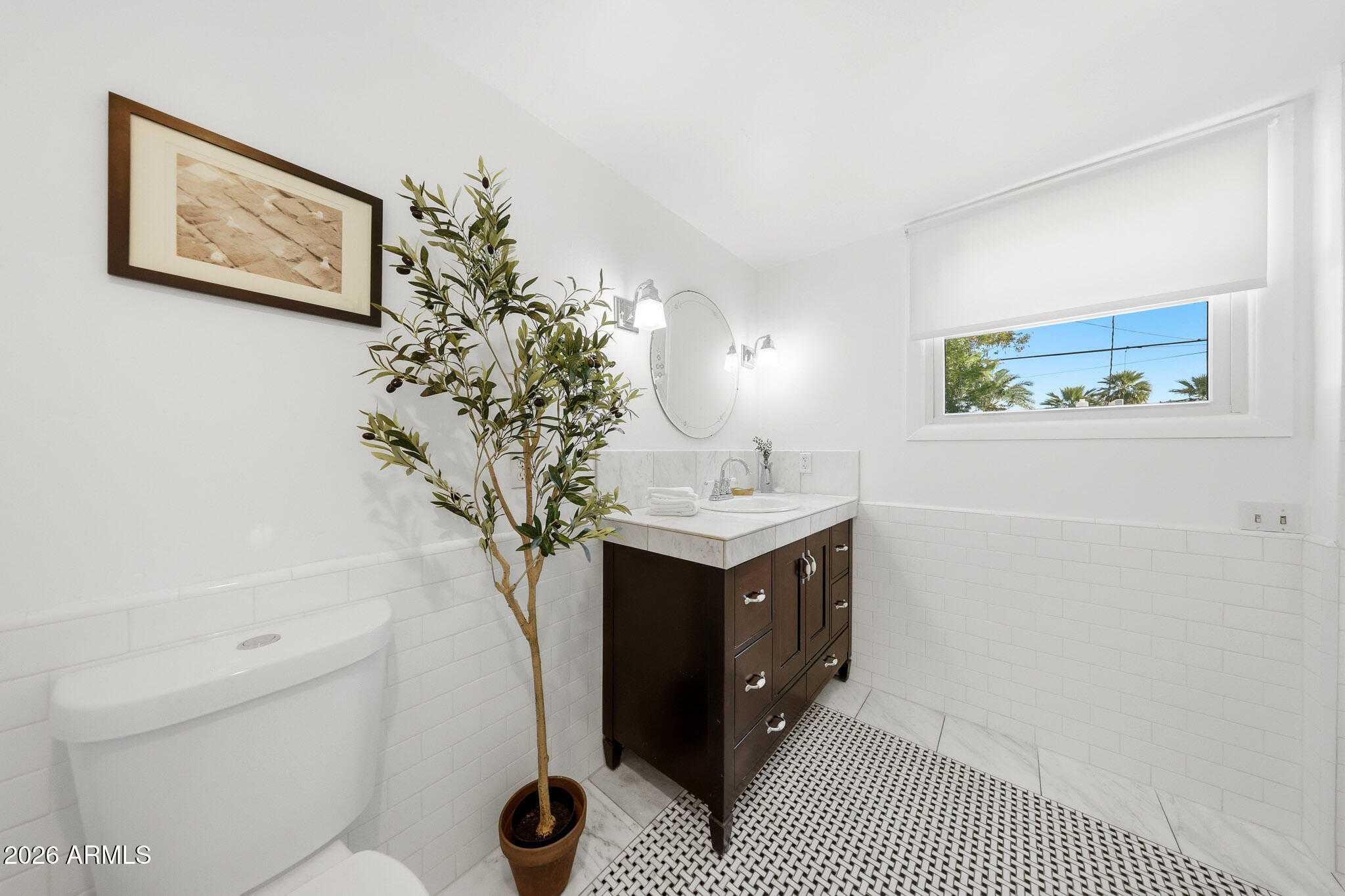 1555 East Cheery Lynn Road Phoenix, AZ 85014 - Photo 15 of 37 a bathroom with a sink toilet and vanity