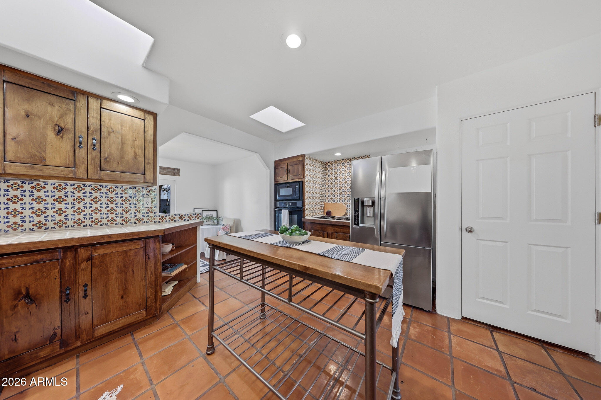 1555 East Cheery Lynn Road Phoenix, AZ 85014 - Photo 21 of 37 a view of a kitchen counter space and wooden floor