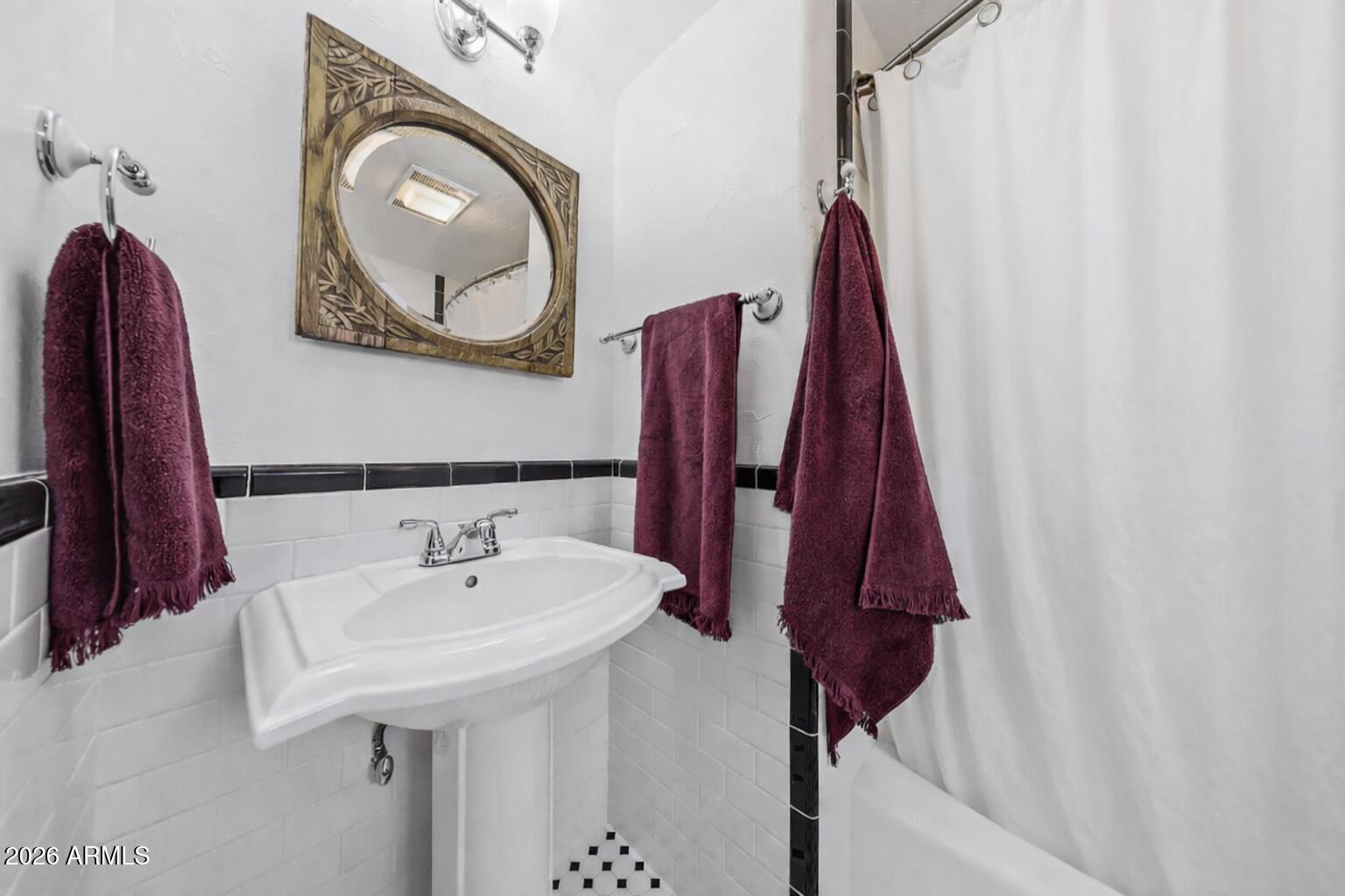 1555 East Cheery Lynn Road Phoenix, AZ 85014 - Photo 28 of 37 a bathroom with a sink and a mirror