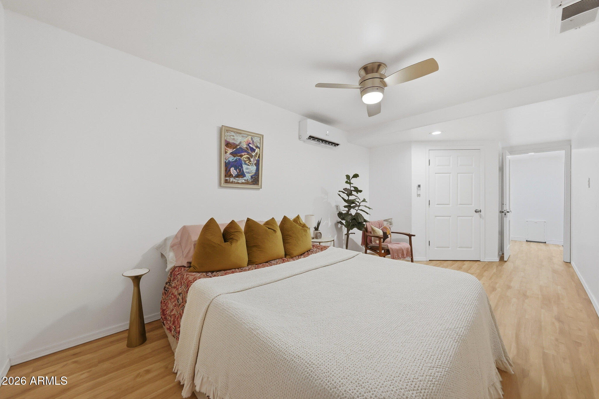 1555 East Cheery Lynn Road Phoenix, AZ 85014 - Photo 30 of 37 a bedroom with a bed and a chandelier