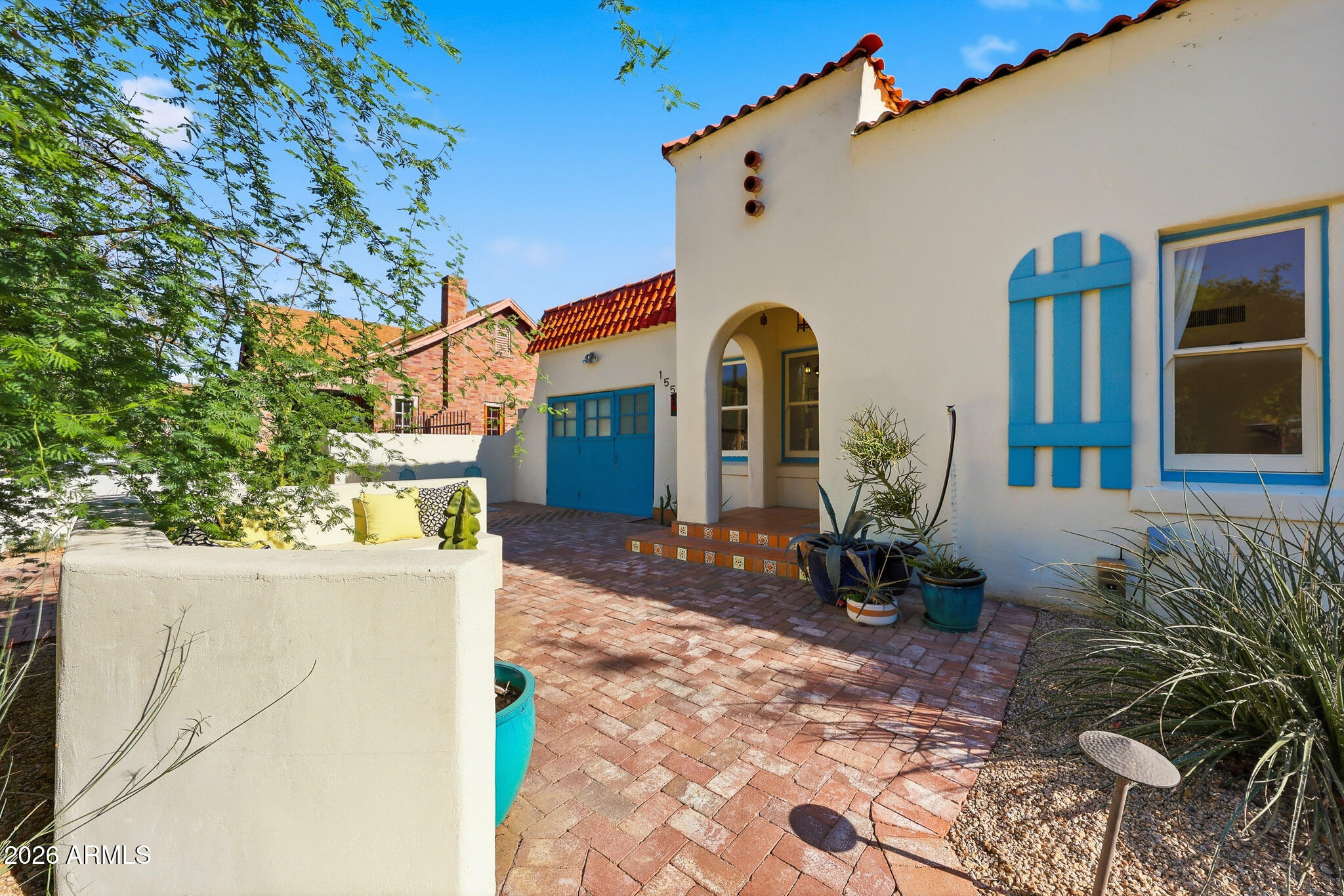 1555 East Cheery Lynn Road Phoenix, AZ 85014 - Photo 4 of 37 a front view of a house with patio