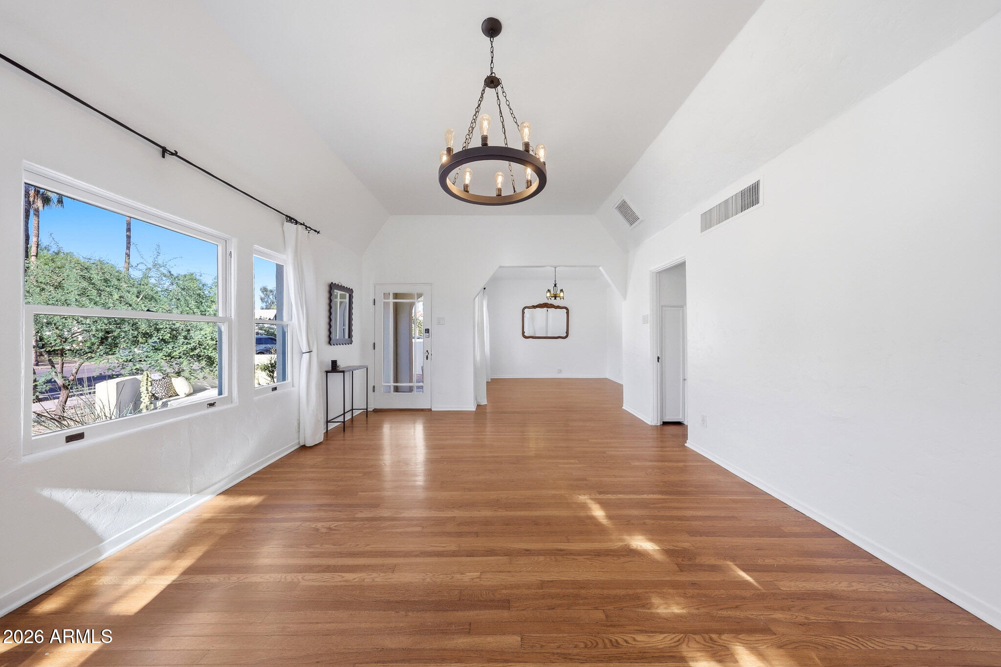 1555 East Cheery Lynn Road Phoenix, AZ 85014 - Photo 9 of 37 a view of empty room with wooden floor and fan