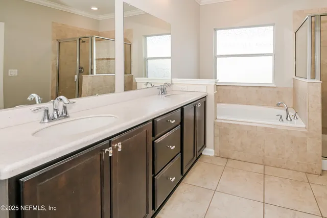 a bathroom with a sink a vanity and a bathtub