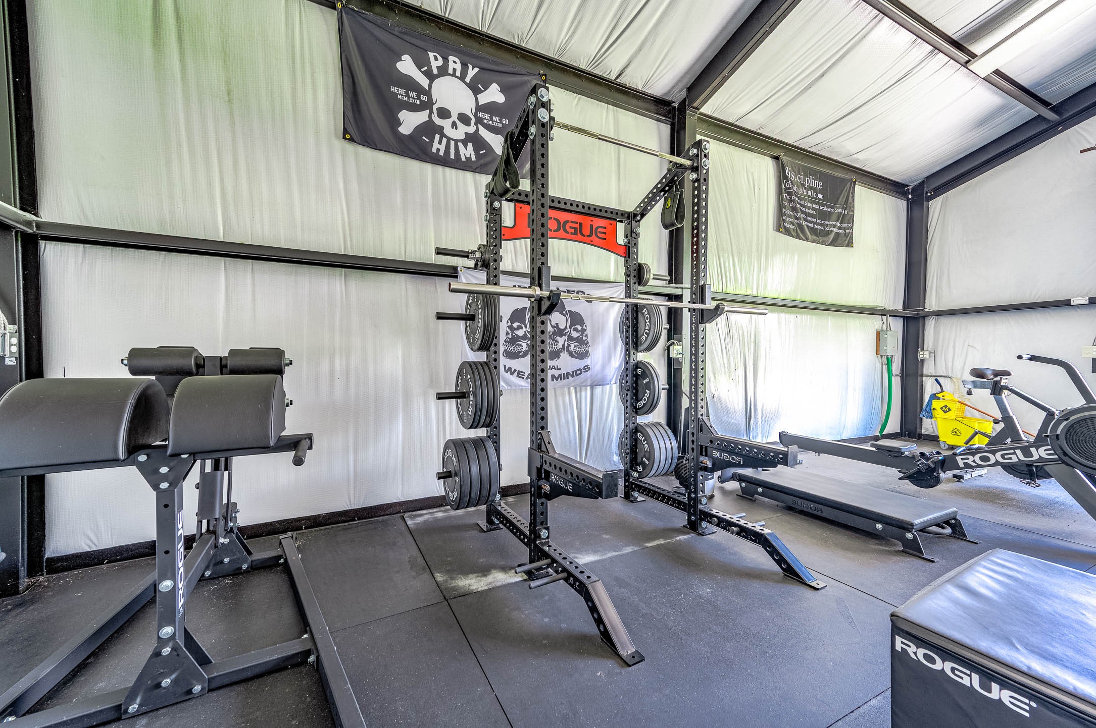 8032 Short Road Needville, TX 77461 - Photo 38 of 50 The interior setup includes a well-equipped fitness area with ample room for strength training, cardio equipment, and workout stations. The organized layout and open design make the space both functional and motivating for everyday use.
