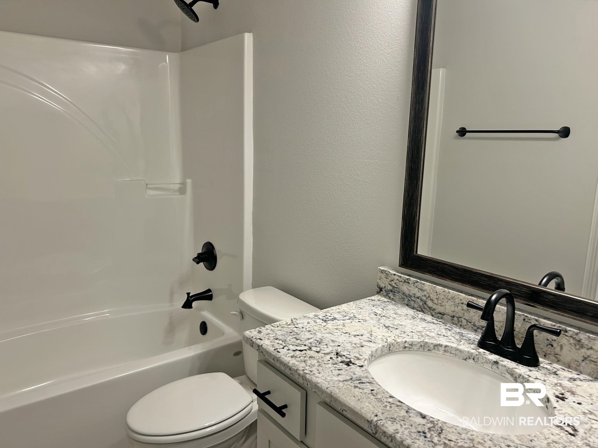 1748 Breckinridge Place Foley, AL 36535 - Photo 18 of 25 Full bath with a textured wall, vanity, and bathtub / shower combination