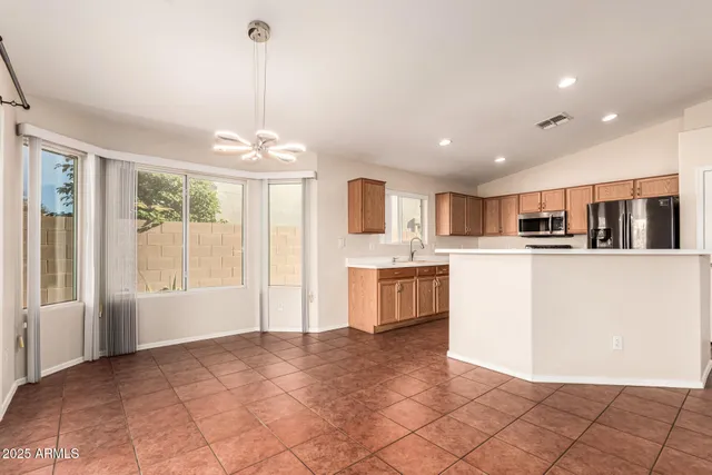 a kitchen with a sink stove and microwave