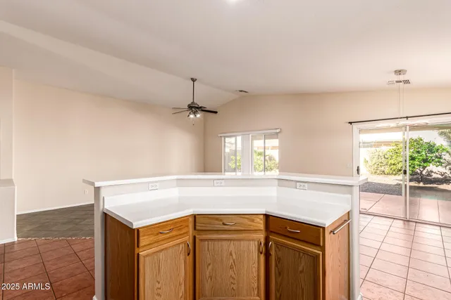 a kitchen with a sink and large window