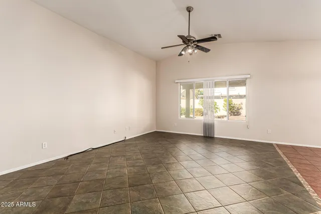 a view of a kitchen with a sink and a window