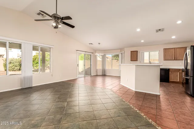 a view of a kitchen with a sink and a window
