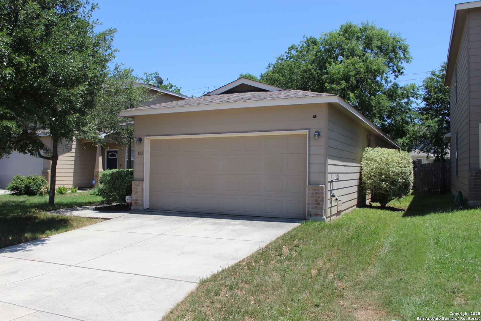 482 Walnut Crest Selma, TX 78154 - Photo 3 of 19 a front view of a house with a yard and garage