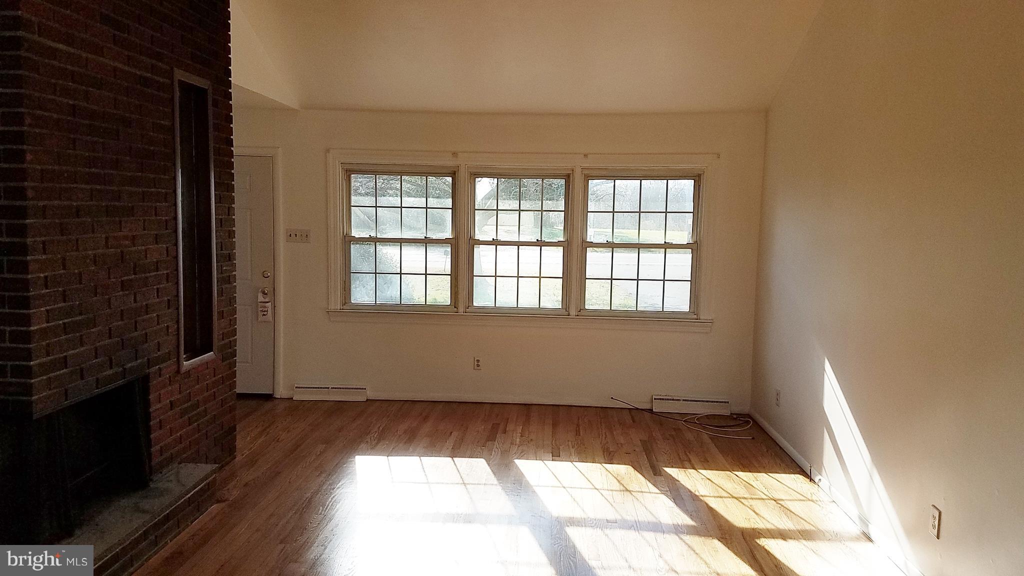 5781 Telegraph Road Elkton, MD 21921 - Photo 10 of 20 Living Room with brick fireplace