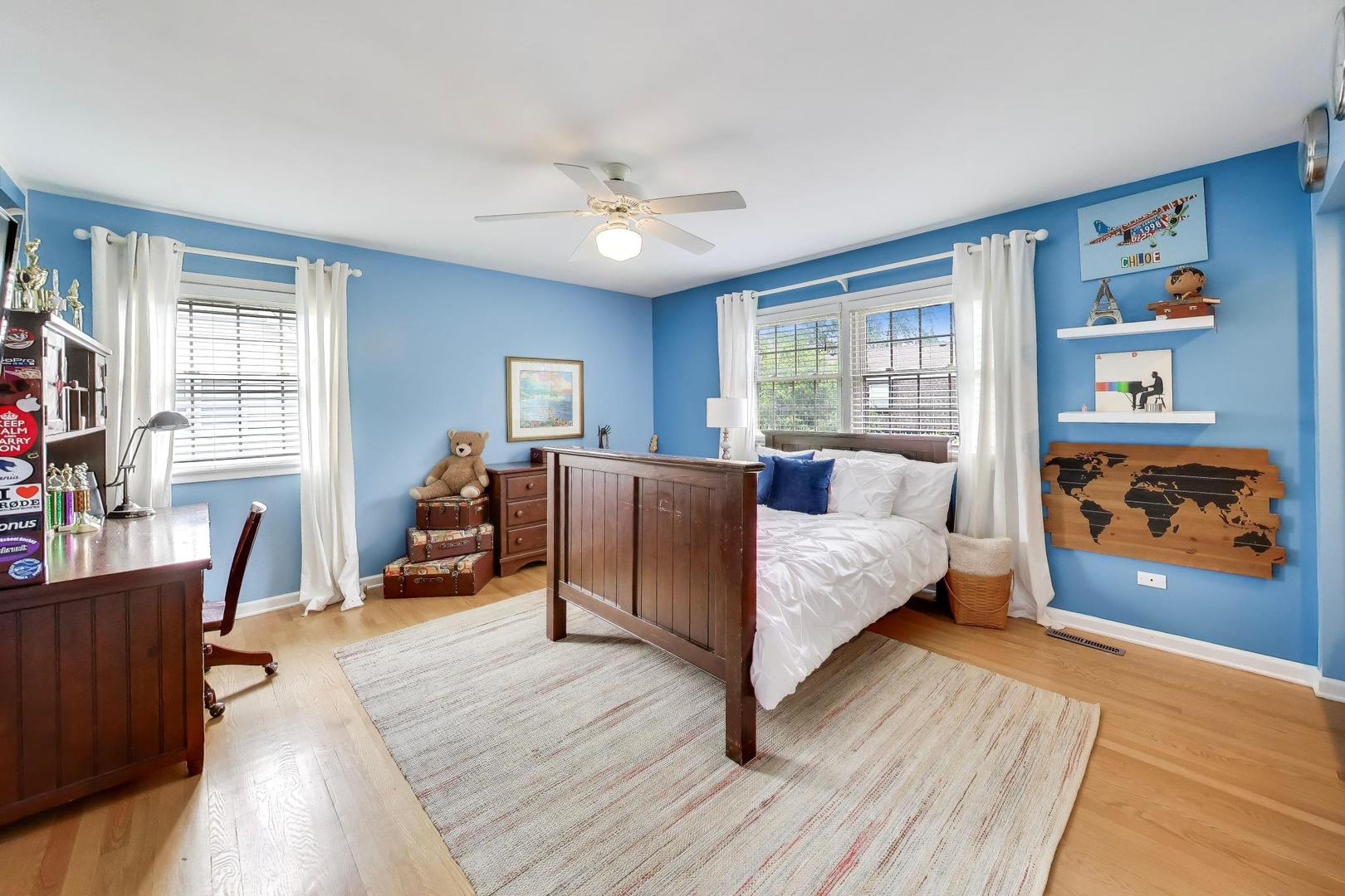 3956 Rutgers Lane Northbrook, IL 60062 - Photo 24 of 41 a spacious bedroom with a large bed and a window