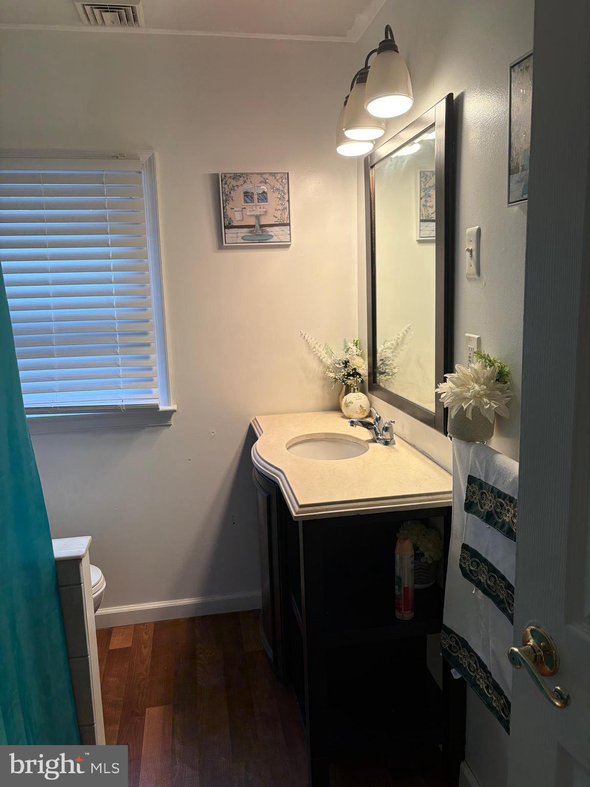 7404 Wyndam Road Pennsauken, NJ 08110 - Photo 33 of 50 a bathroom with a sink and a mirror