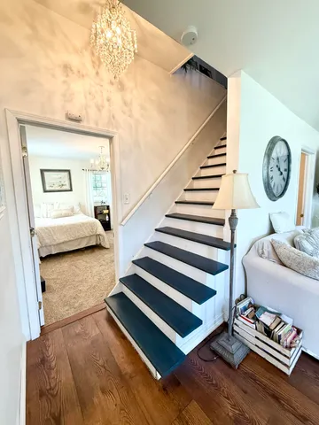 a bedroom with furniture and a book shelf