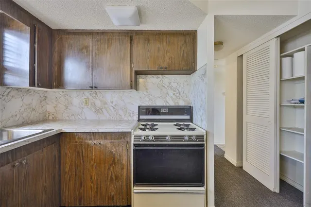 a kitchen with a stove and a microwave
