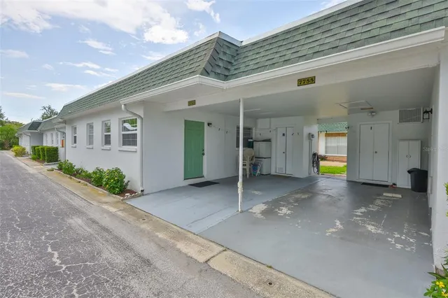 a view of a house with basketball court