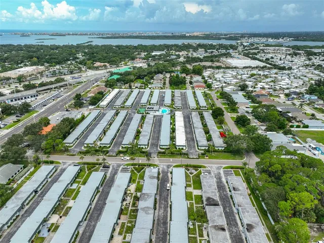 an aerial view of a house with a swimming pool