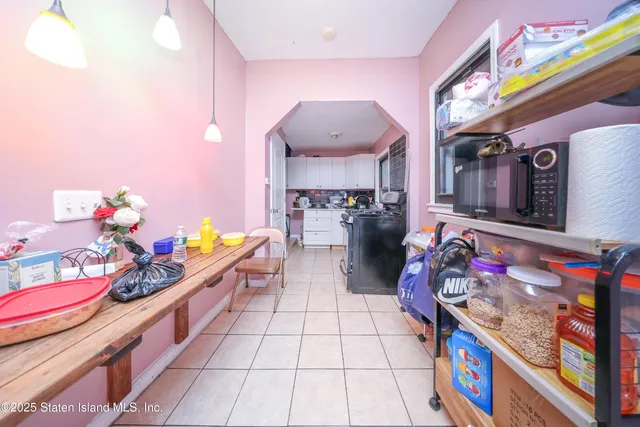 a kitchen with stove and cabinets
