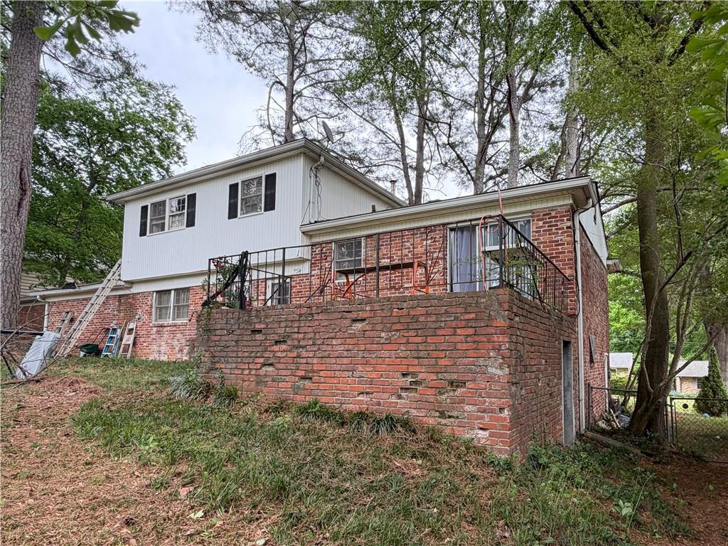 3084 Trafalgar Way Atlanta, GA 30341 - Photo 29 of 31 a view of a house with a large windows and a tree