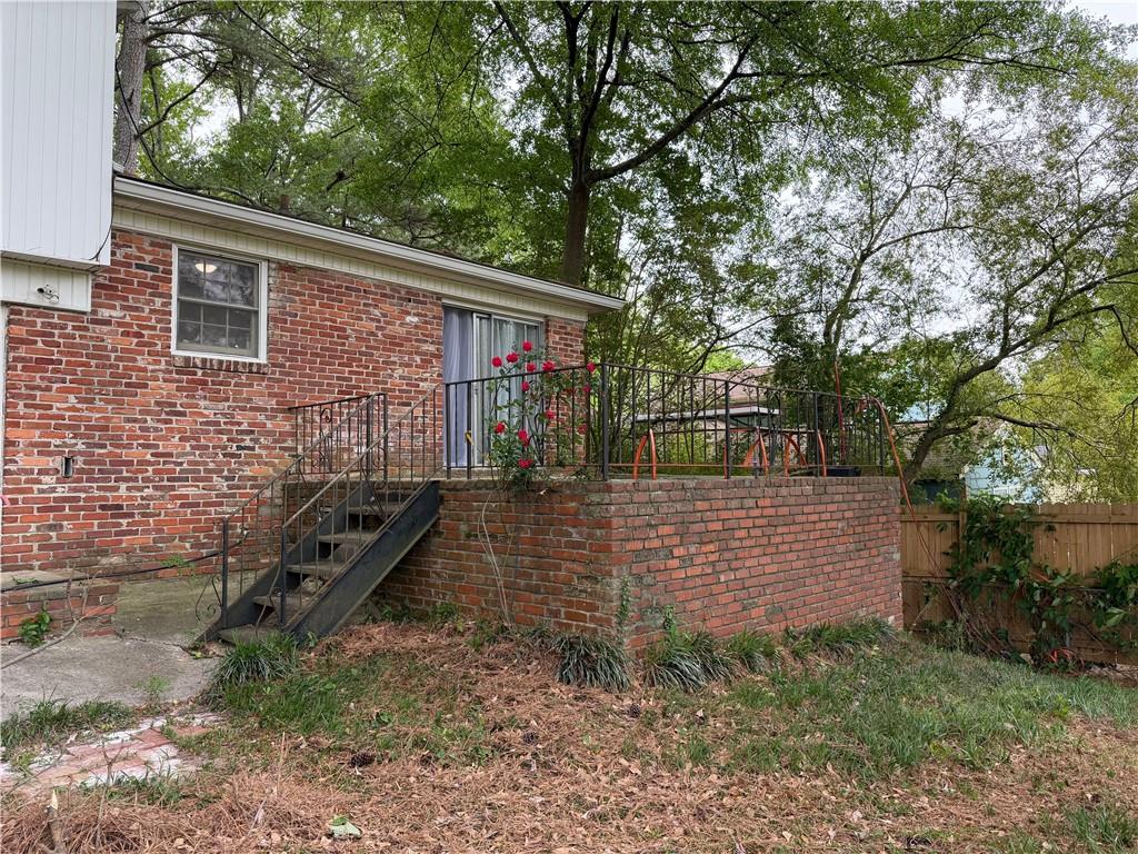 3084 Trafalgar Way Atlanta, GA 30341 - Photo 30 of 31 a view of house with a yard