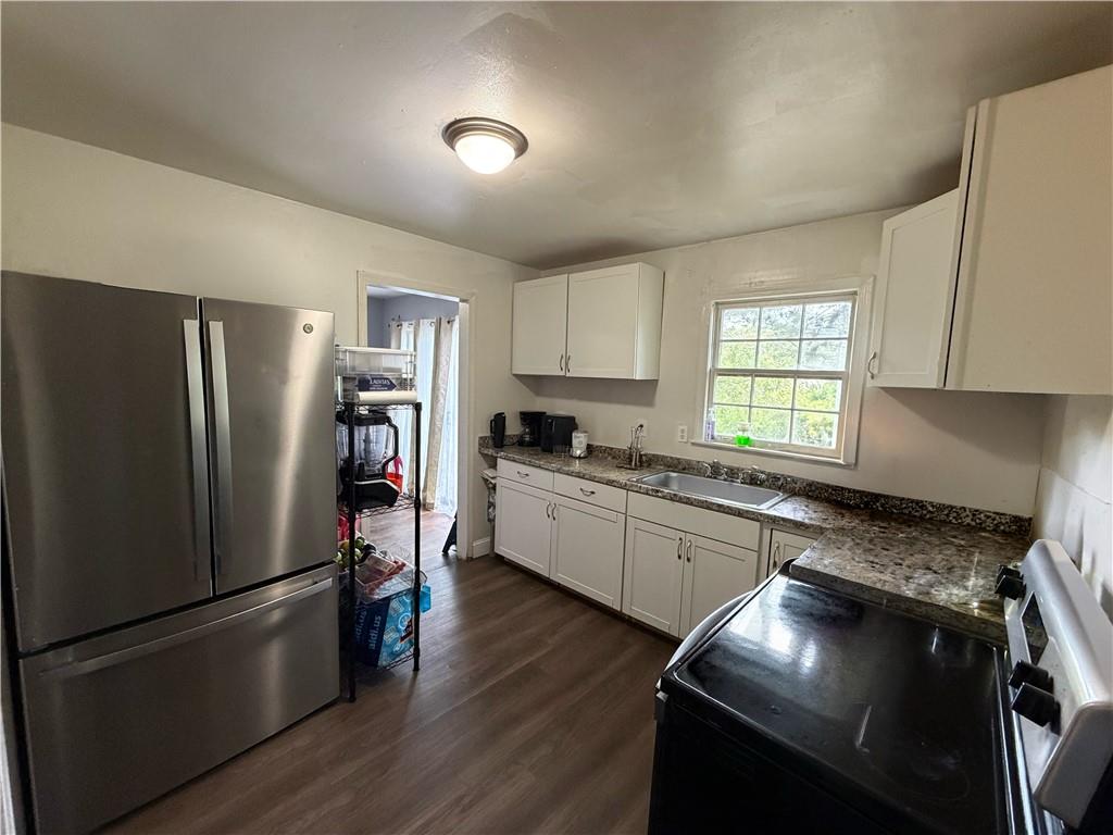3084 Trafalgar Way Atlanta, GA 30341 - Photo 7 of 31 a kitchen with a refrigerator and a stove top oven