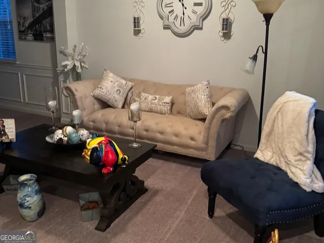 a view of a patio with dining table and chairs
