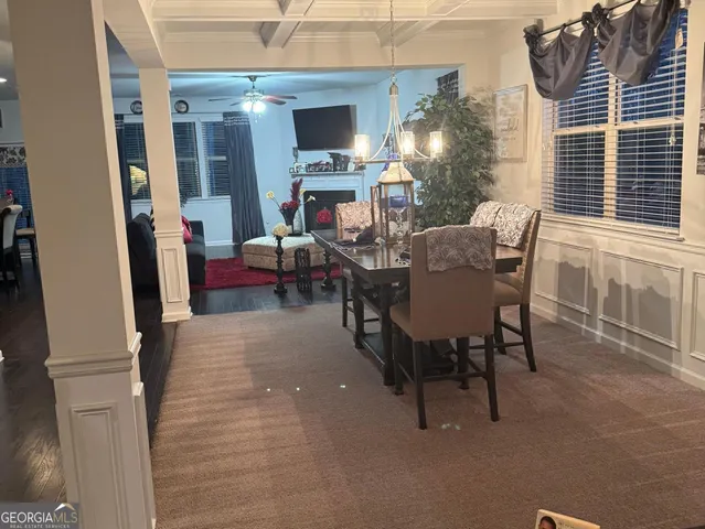 a kitchen with stainless steel appliances granite countertop a stove top oven a sink dishwasher and cabinets with wooden floor