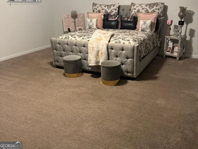 a view of a bedroom with a bed