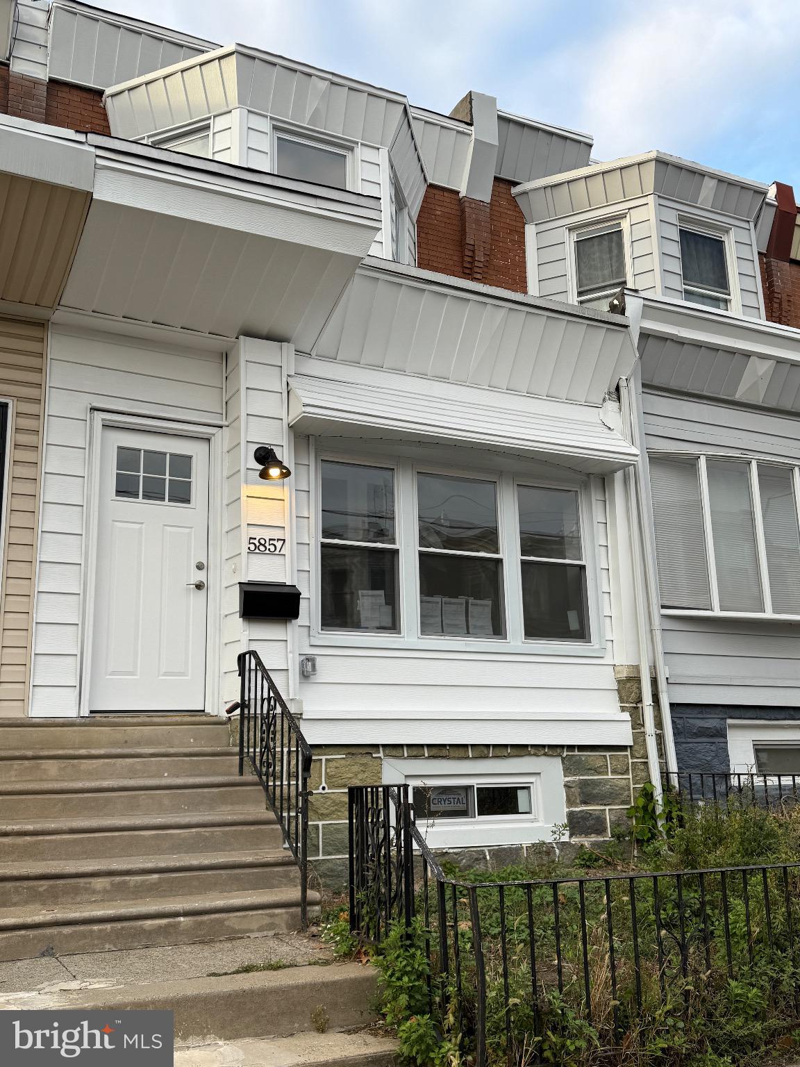 a front view of a house with a balcony