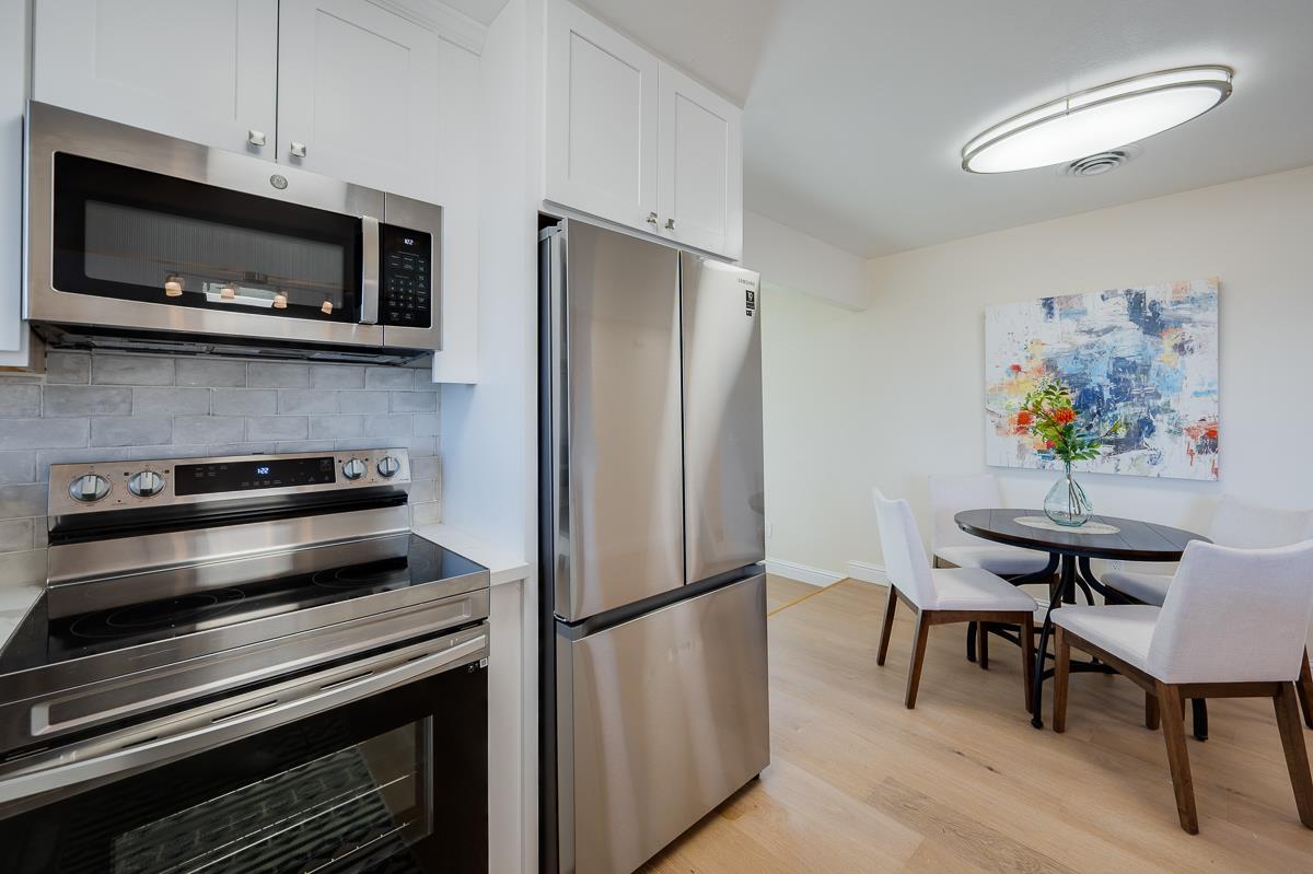 490 Jean Circle Marina, CA 93933 - Photo 15 of 60 a kitchen with stainless steel appliances a stove a microwave and a refrigerator