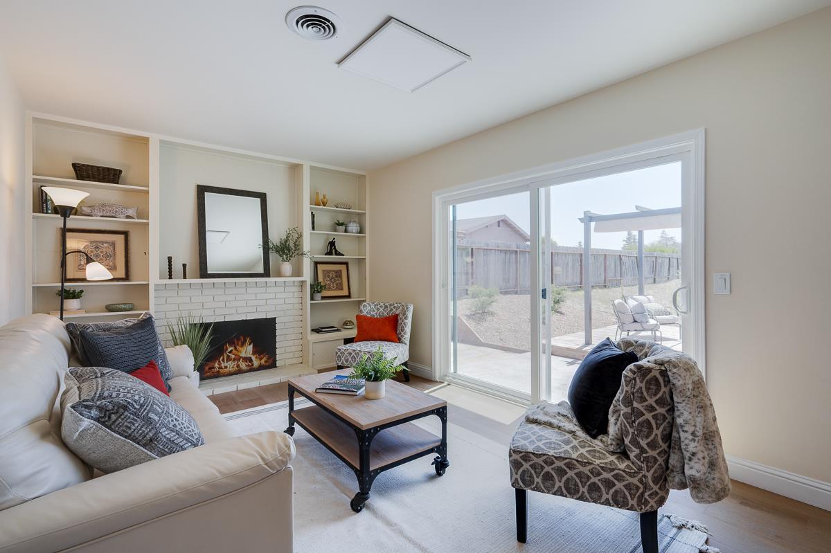 490 Jean Circle Marina, CA 93933 - Photo 22 of 60 a living room with furniture and a fireplace