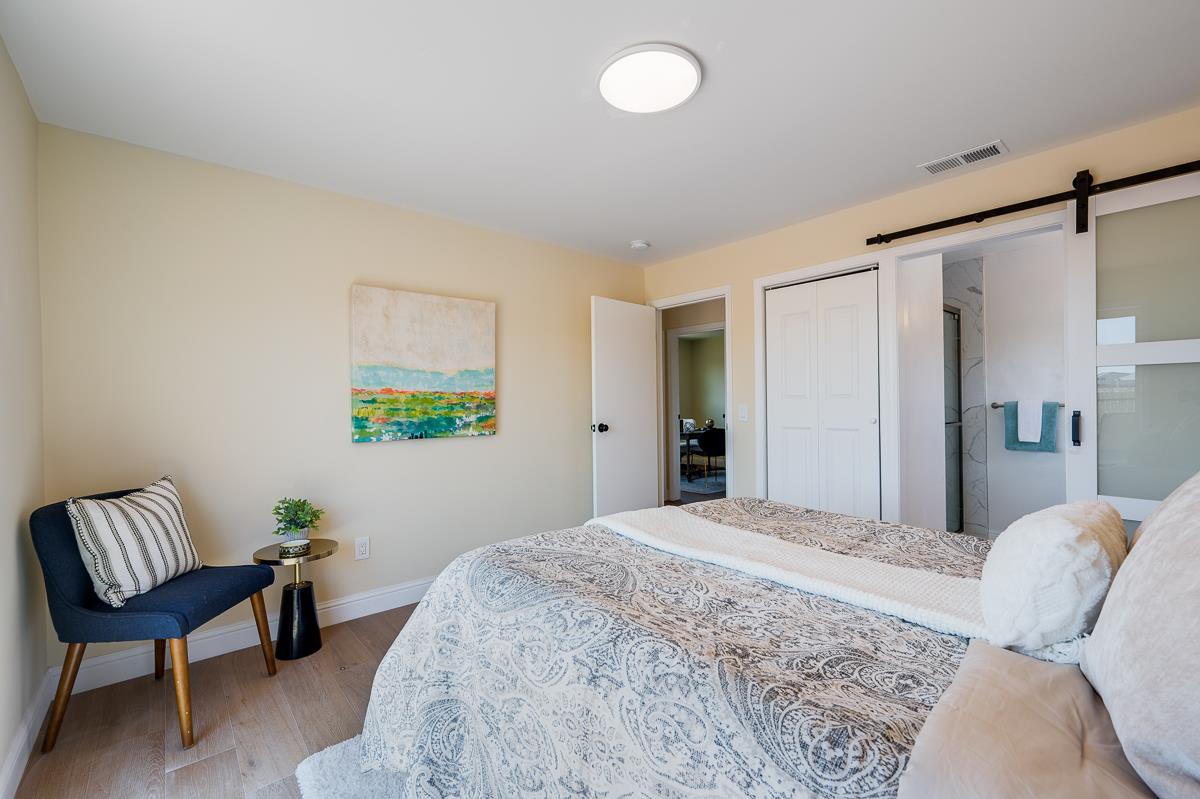 490 Jean Circle Marina, CA 93933 - Photo 26 of 60 a bedroom with a bed and a chair