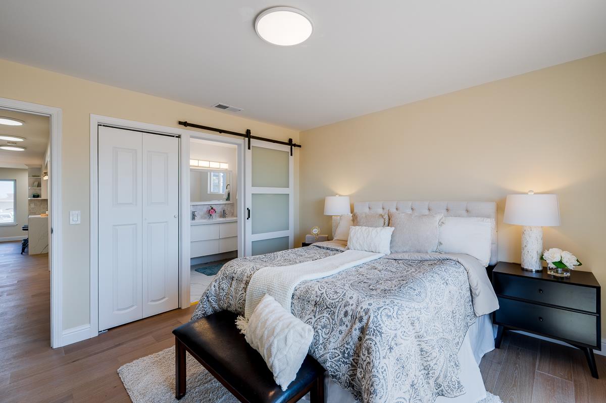 490 Jean Circle Marina, CA 93933 - Photo 28 of 60 a bedroom with a bed and a lamp