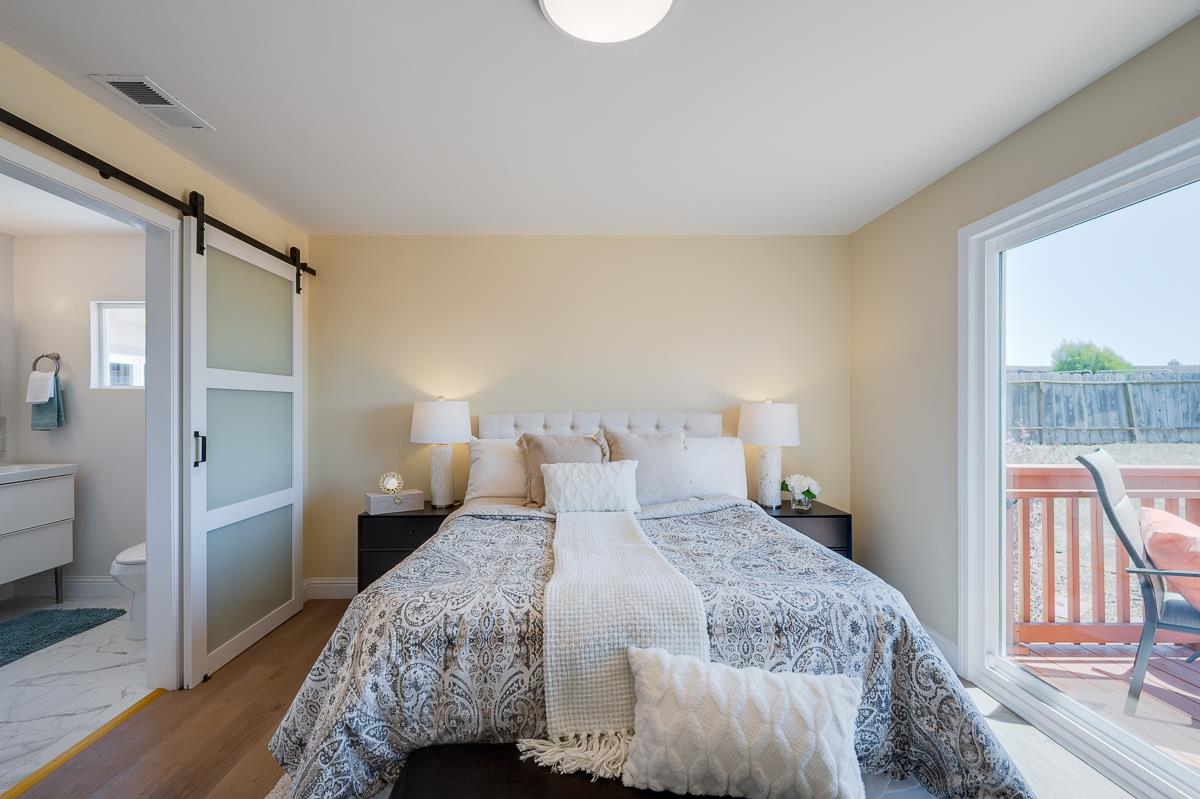 490 Jean Circle Marina, CA 93933 - Photo 29 of 60 a bedroom with a bed and wooden floor