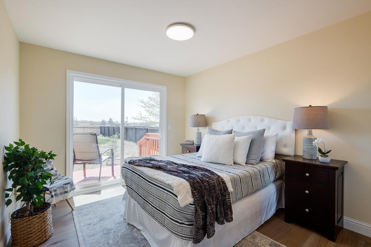 490 Jean Circle Marina, CA 93933 - Photo 35 of 60 a bed room with a bed and a potted plant
