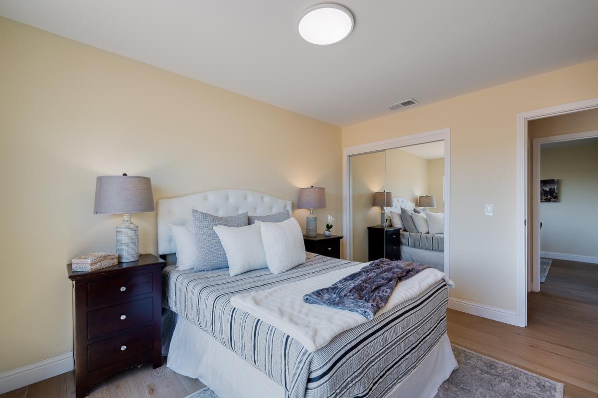 490 Jean Circle Marina, CA 93933 - Photo 37 of 60 a bedroom with a bed and a lamp