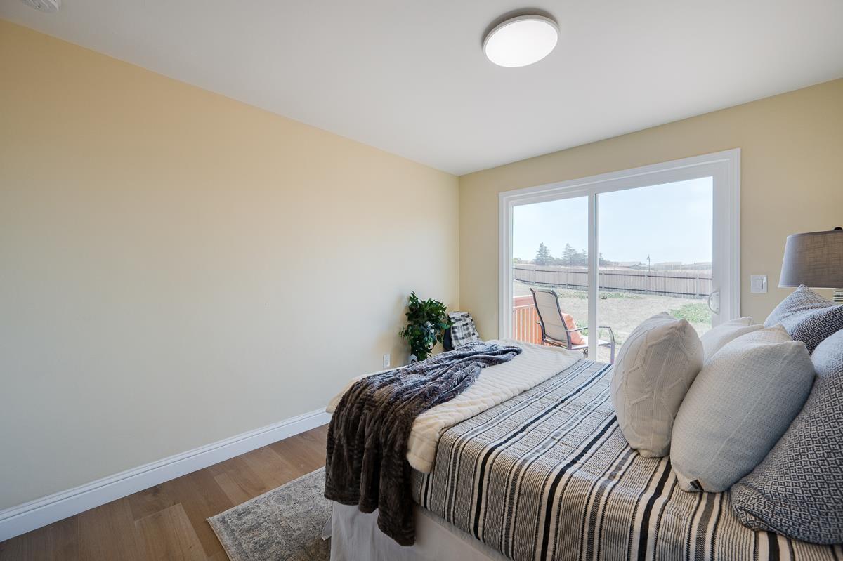 490 Jean Circle Marina, CA 93933 - Photo 38 of 60 a bedroom with a bed and a large window