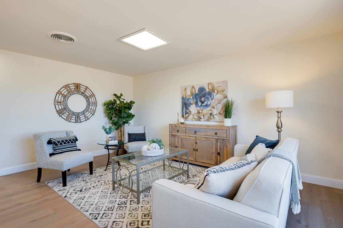 490 Jean Circle Marina, CA 93933 - Photo 4 of 60 a living room with furniture a rug and a lamp