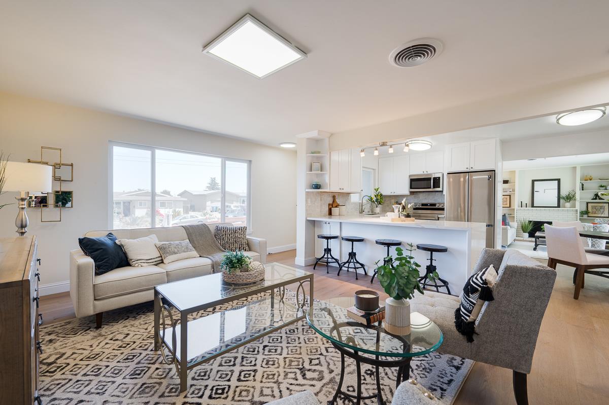 490 Jean Circle Marina, CA 93933 - Photo 7 of 60 a living room with furniture dining table and a large window