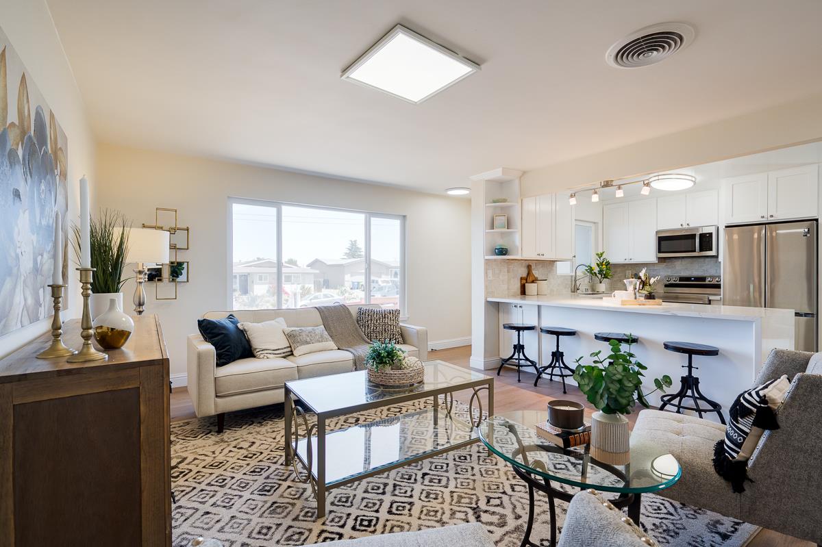 490 Jean Circle Marina, CA 93933 - Photo 8 of 60 a living room with furniture dining table and a large window