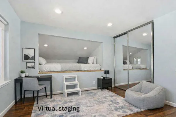 a bedroom with a bed and a lamp