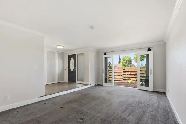 an empty room with an empty space and wooden floor