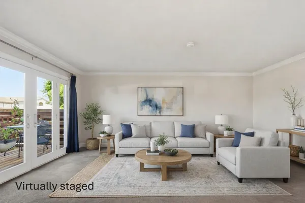 a living room with furniture and a rug
